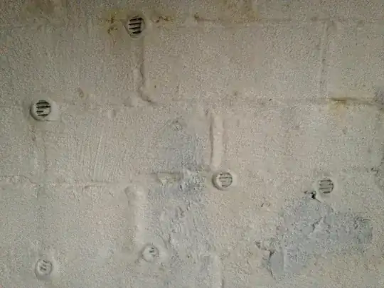 Vents hammered into mortar of a brick foundation