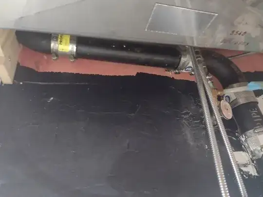 upward-looking shot under the sink, how the “vertical” pipe comes horizontally out of the wall to the left before elbowing down to be vertical