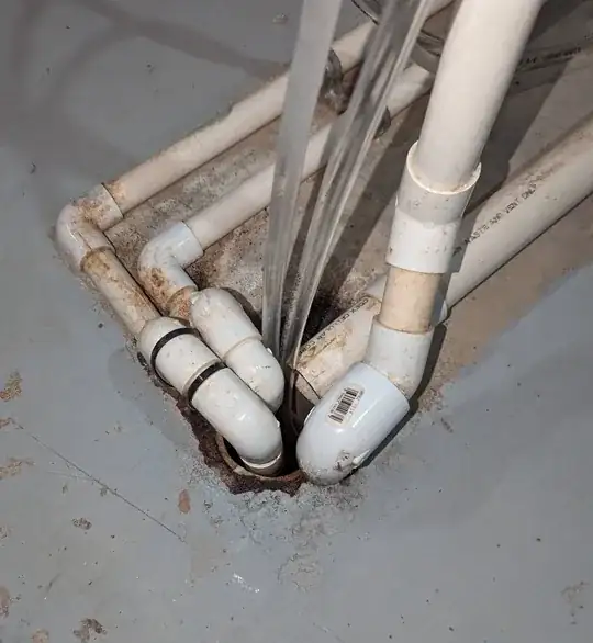 Pipes crowded in floor drain