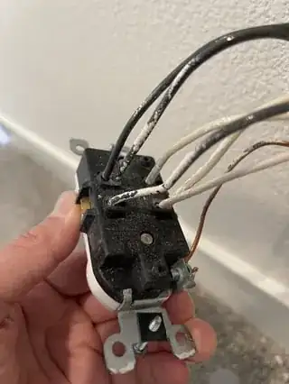 Closeup of old, wired outlet