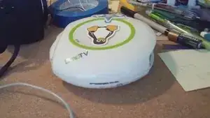 With your hands or the help of a flathead screwdriver, remove the top of the LeapTV