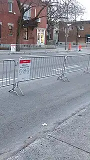 Metal barricades with signs