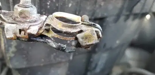 battery terminal clamp with part of metal broken off