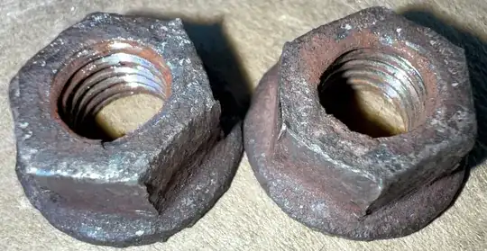 close up of removed muffler flange nuts