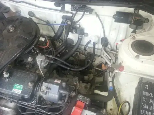 Engine compartment showing fuel filter on firewall