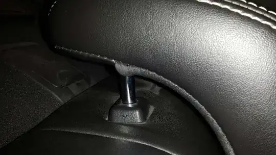 2010 Fusion rear headrest removal pinhole