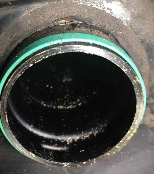 Gas tank orifice with part removed.