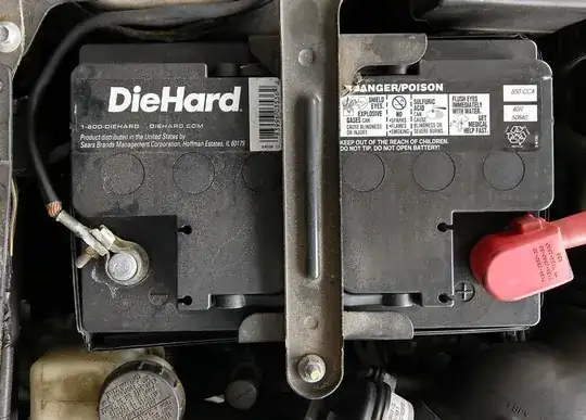 Battery with loose black clamp