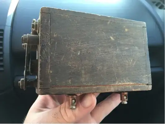 wooden box with exposed terminals and a relay on one end