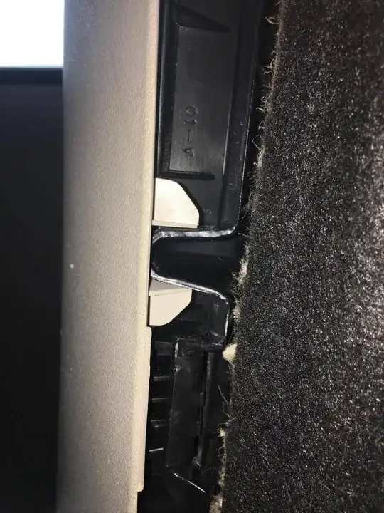 Area under the glove box where it connects to the fabric