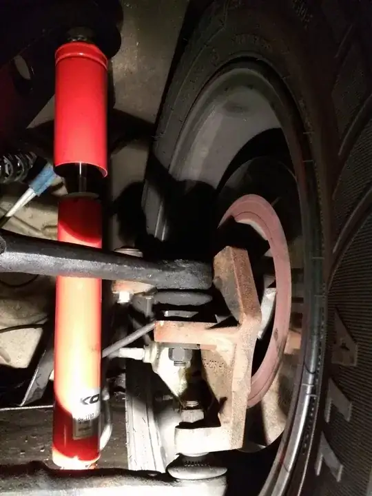 Image: shows shock fully extended on the ground