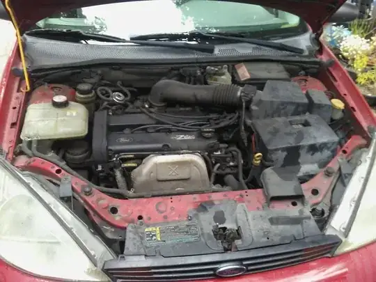 photo of dirty ford focus engine bay