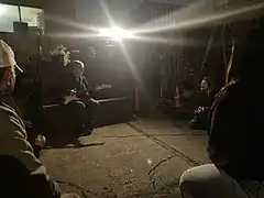 Ana Martinez de Luco plays guitar at the Earth Day 2023 celebration