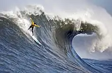 A surfer in the Pacific Ocean at the 2010 Mavericks competition, village of Princeton-by-the-Sea, northern California