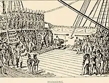 A sketch at the back of a sailing ship's top deck, showing a man tied up on a grate to be flogged for desertion; to the left overlooking the scene from the deck above are Marines in line with bayonets; crowded to the right are the ship's crew mustered to watch the punishment being administered.