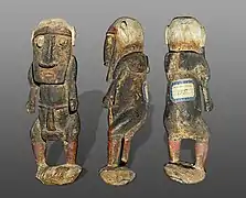 Male statuette wearing a penis sheath statement