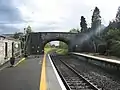 Looking south in 2009. The bridge is the R296 road to Tubbercurry.  The steps to the now disused down platform were the only means of access.