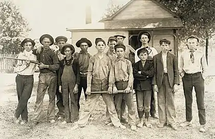 Image 9Photograph of glassworkers by Lewis HinePhotograph: Lewis Hine; restoration: Lise BroerA baseball team composed mostly of child laborers from an Indiana glassmaking factory, as photographed by Lewis Hine in August 1908. Hine (1874–1940) was an American sociologist who promoted the use of photography as an educational medium and means for social change. Beginning in 1908, he spent ten years photographing child labor for the National Child Labor Committee. The project was a dangerous one, and Hine had to disguise himself&nbsp;– at times as a fire inspector, post card vendor, Bible salesman or industrial photographer&nbsp;– to avoid the factory police and foremen.More featured pictures