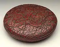 He (Box) with Pair of Pheasants in Peonies, late Ming, 19&nbsp;cm wide.  Thin top layers of red over black give effective contrasts.