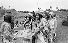 Image 9Eastern German reenacters at an Indianistikmeeting in Schwerin, 1982. The popular image of Native Americans made Native American living history quite popular in East Germany. (from Culture of East Germany)