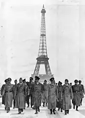 Adolf Hitler strolling in front of the Eiffel tower in Paris, 23 June 1940.