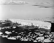 Image 69An iceberg being pushed out of a shipping lane by (L to R) USS Burton Island, USS Atka, and USS Glacier near McMurdo Station, Antarctica, 1965 (from Southern Ocean)