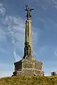 The war memorial at Aberystwyth seafront. The bottom figure represents Humanity and the top Victory