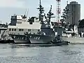 JS Yūdachi alongside JS&nbsp;Fuyuzuki and JS&nbsp;Hyūga at Yokosuka on 25 September 2017.