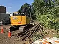 Excavator with rail removed from Watertown Branch for Phase II path construction, Sept. 2018