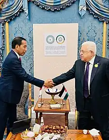Joko Widodo and Mahmoud Abbas shook hand.