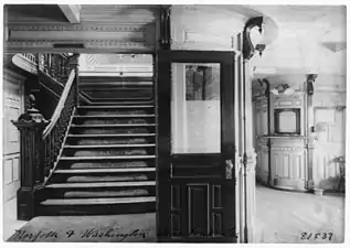 Interior view of steamboat showing stairway and pursers office