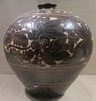 floral design cut into the slip, 14th century