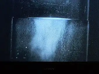 Liquid helium (in a vacuum bottle) at 4.2&nbsp;K (−268.95&nbsp;°C) and 1&nbsp;bar (15&nbsp;psi) boiling slowly.