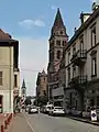 View to a street with reformed church and catholic church in the background