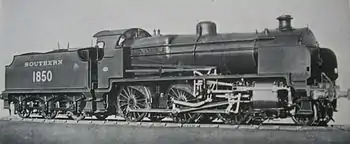 Official side view of a 2-6-0 locomotive against a white background. The distinguishing feature from normal N class locomotives is the experimental motion that powers the wheels.