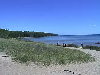 Looking north at the beach with kayakers