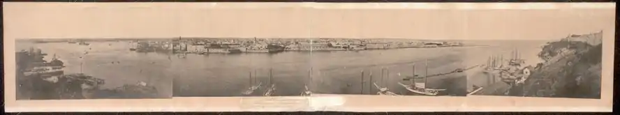 Panoramic view of Havana, showing the entrance to the harbor and inner harbor; taken from Cabanas Fortress showing Morro Castle on the extreme right-handMalecón