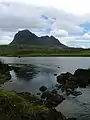 River Kirkaig. For a short distance after it leaves Fionn Loch the river meanders before garthering speed and tumbling down the Falls of Kirkaig. Caisteal Laith the highest summit of Suilven dominates the scene.
