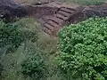 Rockcut steps to a large cistern pavurallakonda