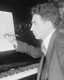 Samuel Gardner composing at a Hamilton piano between 1915 and 1920