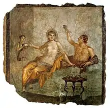 Image 19A late Republican banquet scene in a fresco from Herculaneum, Italy, c. 50 BC; the woman wears a transparent silk gown while the man to the left raises a rhyton drinking vessel (from Culture of ancient Rome)