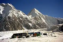 South Inylchek Base Camp, at 4,000&nbsp;m on the glacier's southern moraine, looking northwest to Chapaev Peak and Khan Tengri in the distance