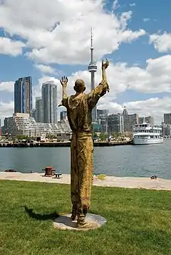 Migrants (bronze), 2007, Ireland Park, Toronto Harbourfront. The Jubilant Man stands 320&nbsp;cm tall.