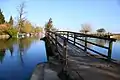 The Thames Path footbridge on Fiddler's Island, looking north