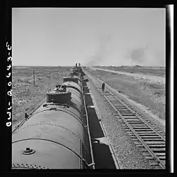Santa Fe train stopping for water at Tolar, March 1943