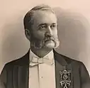 Crystal clear etching of Attorney William Andrew Sutherland in a tuxedo with a white bow tie, a pin representing his rank as a grand master among Masons.