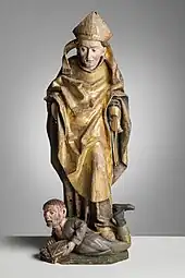 Wooden sculpture of Henry stepping on a bloodied Lalli from Akaa church, c. 1500